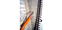 Picture of a dictionary, notebook, and a pencil representing the division of Education, retention, and workforce development.